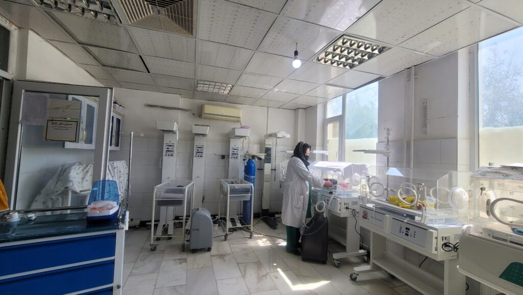 A health worker caring for newborns